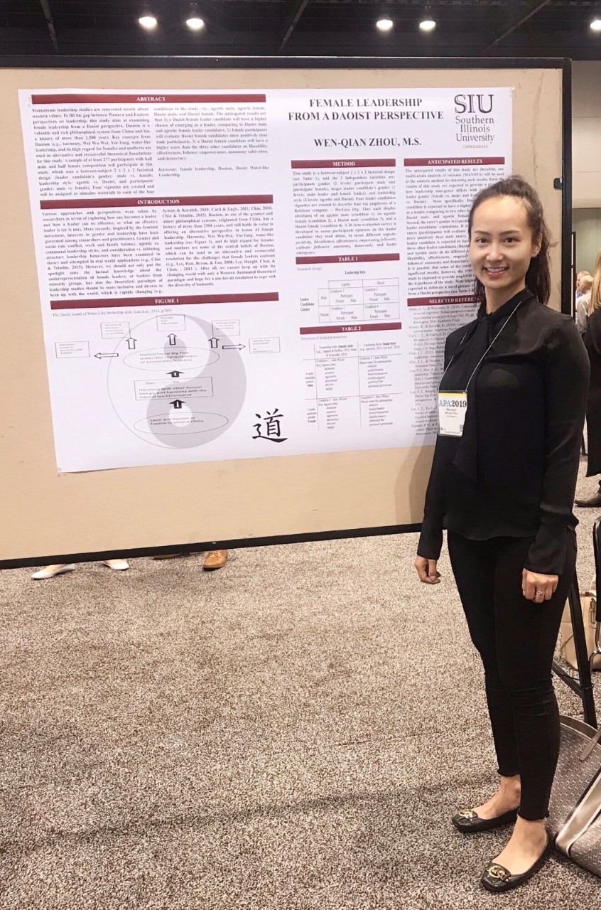 ARC Associate in front of her poster at the 2019 APA Conference